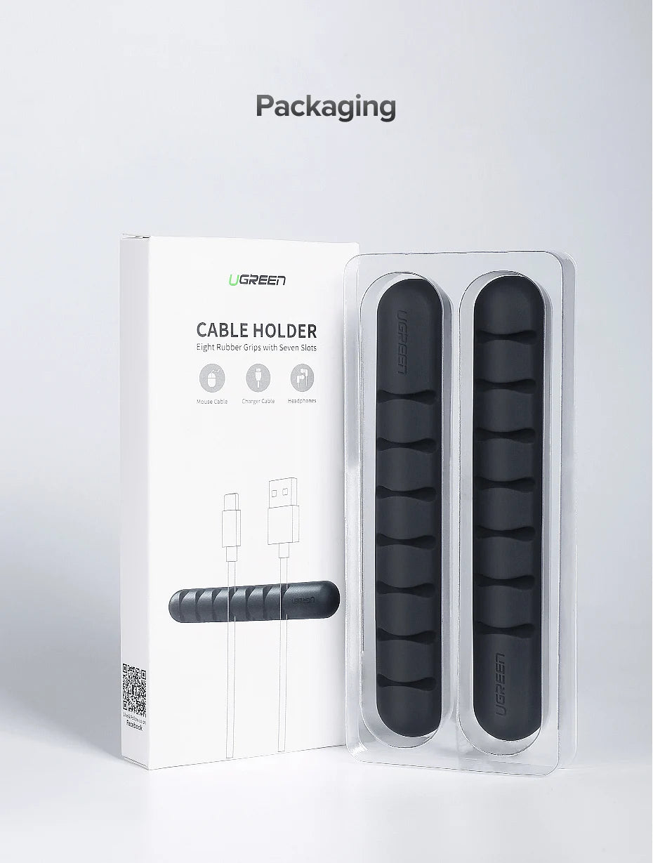 UGREEN cable holder packaging and two black rubber grip cable organizers shown in clear blister packaging on a light gray background, with the word 'Packaging' above.