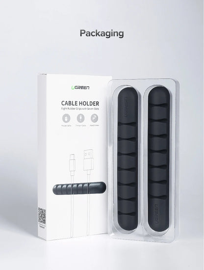 UGREEN cable holder packaging and two black rubber grip cable organizers shown in clear blister packaging on a light gray background, with the word 'Packaging' above.