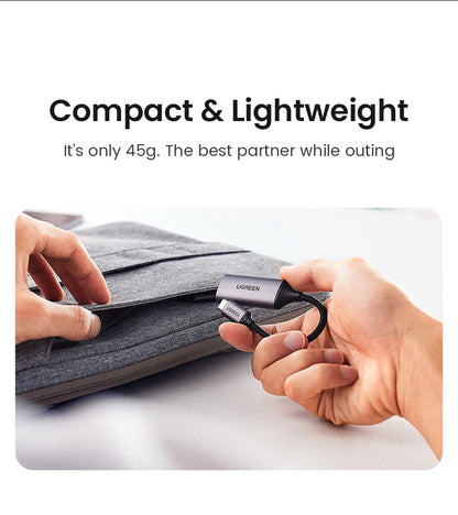 Compact and lightweight device being held by a person with text highlighting its weight and portability.