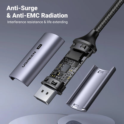 Close-up of a USB cable with metallic connectors on a light gray background