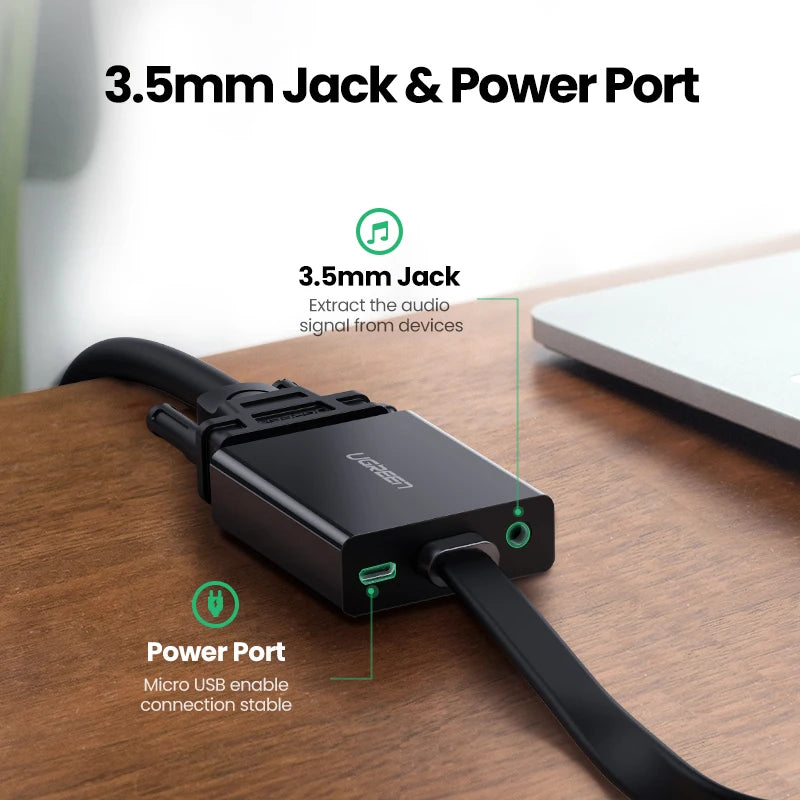 A black USB adapter on a wooden desk with text callouts reading '3.5mm Jack & Power Port,' '3.