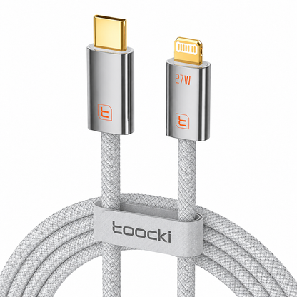 A coiled light gray braided USB-C to Lightning cable with gold-plated connectors and a light gray loop clip printed with the brand name 'tooocki'.