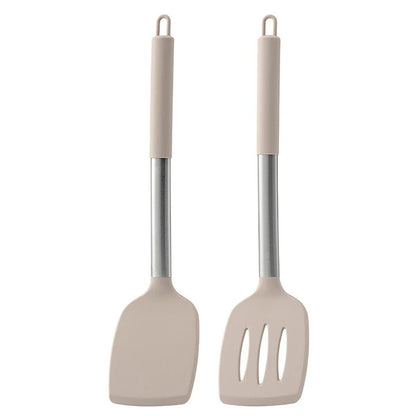Two beige kitchen utensils with metal handles on a white background