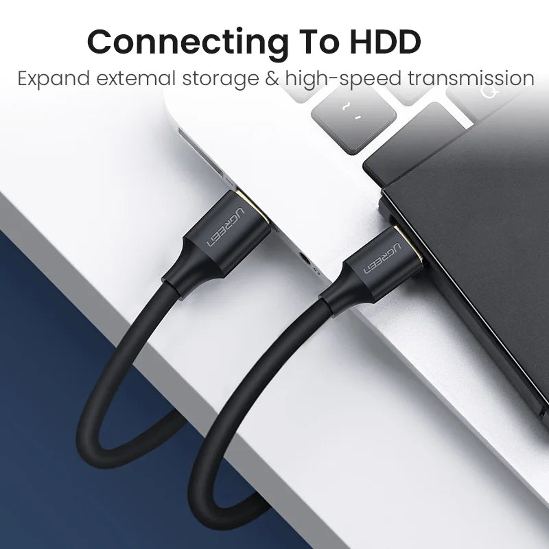 USB cable connecting to an external hard drive with text on a blurred background