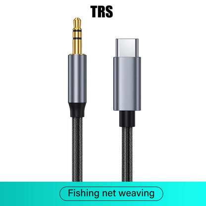 A USB-C to 3.5mm audio adapter cable with a silver and black metallic housing and braided black cable, shown on a white background with 'TRS' text at the top and a teal banner at the bottom reading 'Fishing net weaving'.