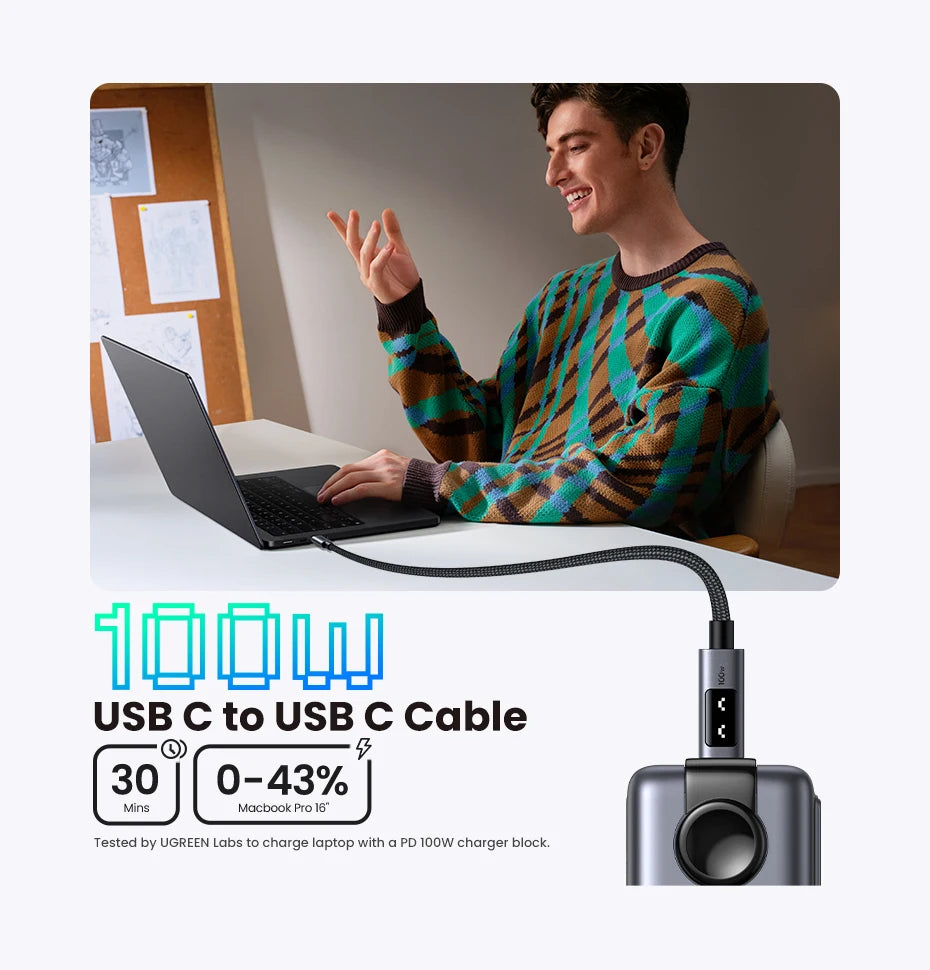 Person using a laptop with a USB C to USB C cable, featuring text about power delivery.
