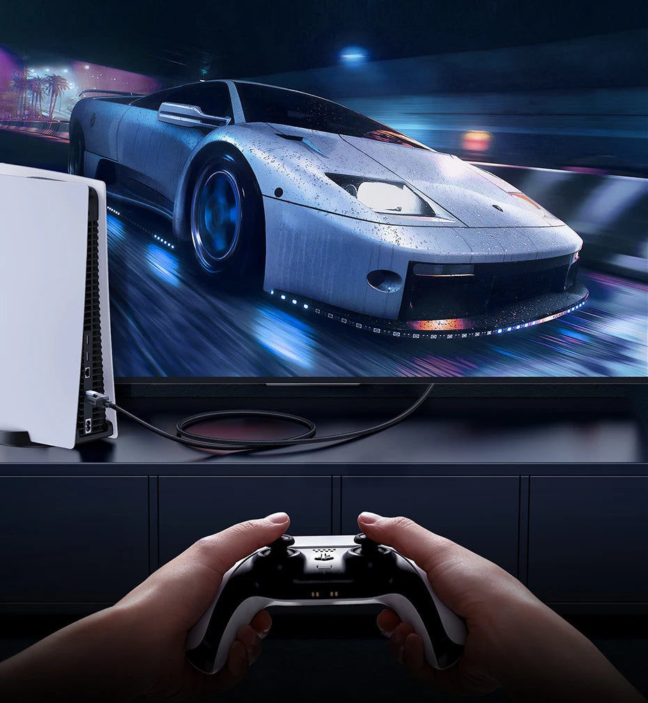 Person playing a racing game on a TV with a controller, showing a high-tech car on the screen.