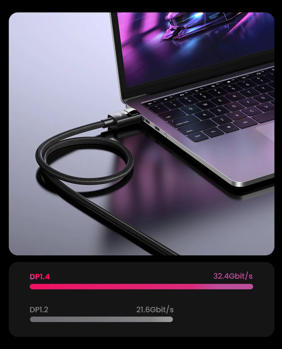 A black braided USB-C cable connected to a silver laptop on a dark reflective surface, with a black overlay at the bottom showing DPI.4 and DPI.