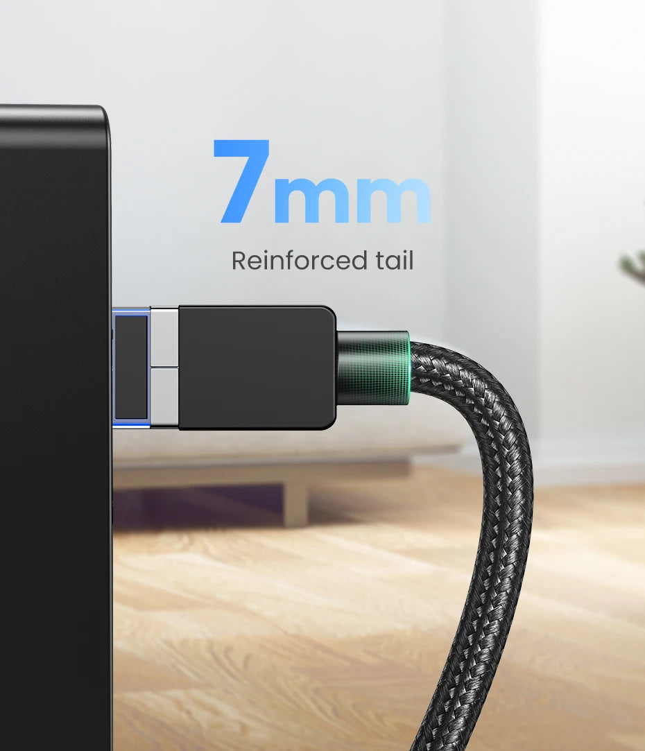 Close-up of a USB-C cable with a 7mm reinforced tail on a blurred background