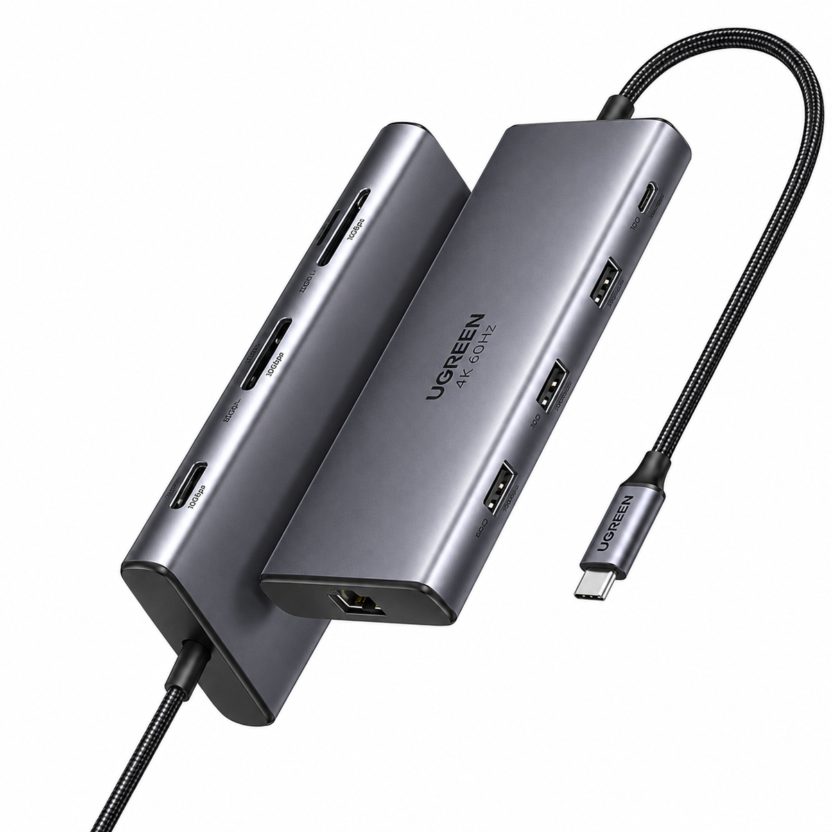 A UGREEN 7-in-1 USB-C hub in dark gray aluminum, shown with two angled views of the hub body and a black braided USB-C cable on a plain white background.