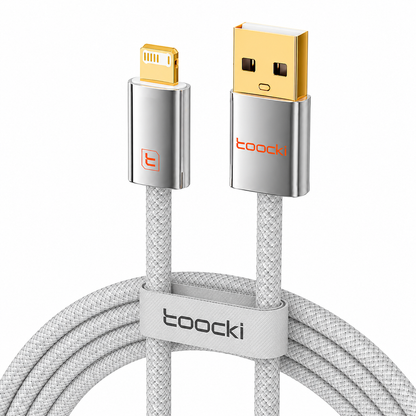 A coiled light gray braided USB-A to Lightning cable with metallic silver and gold connector housings, a light gray branded loop, and the tooocki logo visible on the USB end and loop.