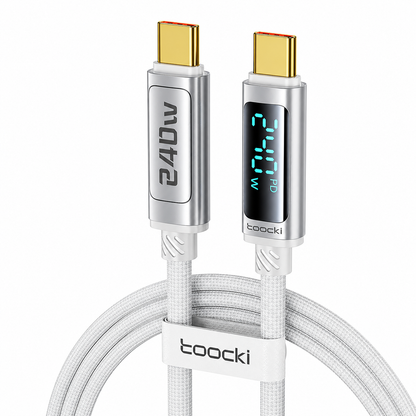 A white braided USB-C charging cable with gold-toned USB-C connectors, featuring a digital display on one connector showing 240W and a white loop clip labeled 'tooocki' in the center.