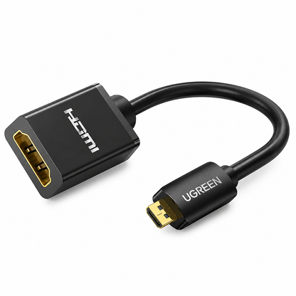 A UGREEN HDMI to Micro HDMI adapter cable on a clean white background. The adapter is black with gold-plated connectors and features the 'UGREEN' brand logo on the Micro HDMI plug and 'HDMI' text on the HDMI plug.