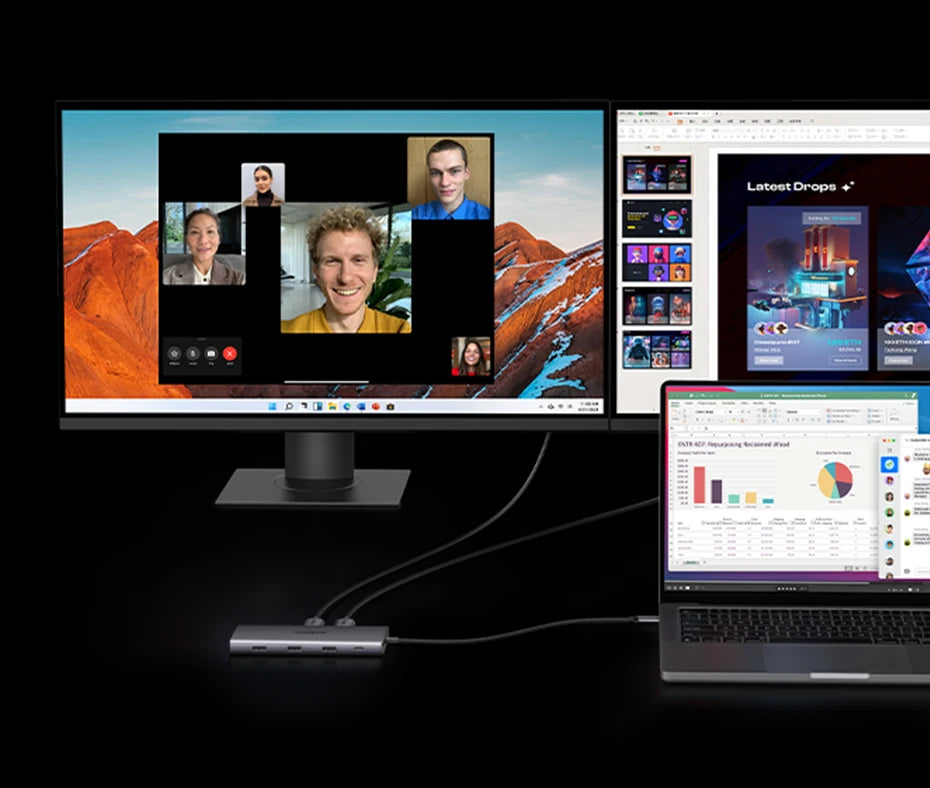 Computer monitor and laptop displaying multiple applications on a black background