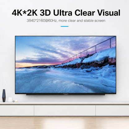 A large flat-screen TV mounted on a white wall above a white console, showing a snowy coastal landscape on the screen. Text at the top reads '4K*2K 3D Ultra Clear Visual' with additional screen spec text.