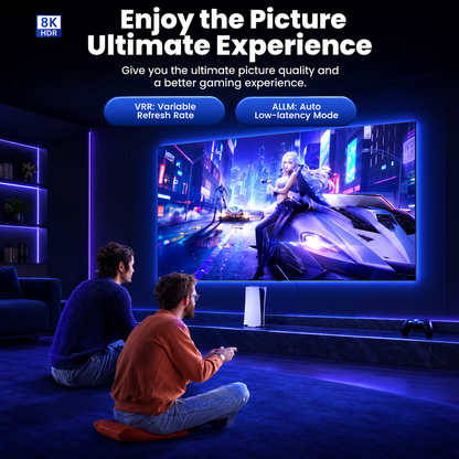 Two people sitting on the floor in a dimly lit room watching a large wall-mounted TV displaying a futuristic cyberpunk scene. Promotional text at the top reads 'Enjoy the Picture Ultimate Experience' with feature callouts including 'VRP: Variable Refresh Rate' and 'ALLM: Auto Low-latency Mode.