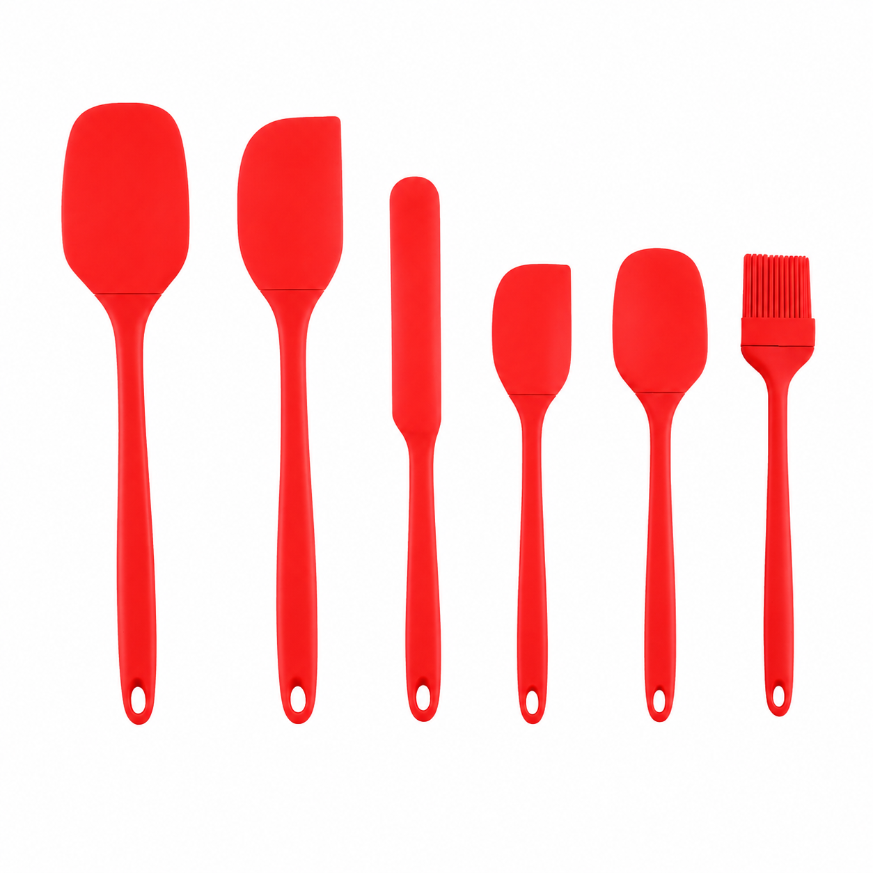 Set of red silicone kitchen utensils including spatulas and a brush on a white background