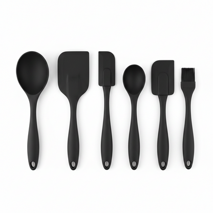 Set of black kitchen utensils including spoons, spatulas, and brushes on a white background