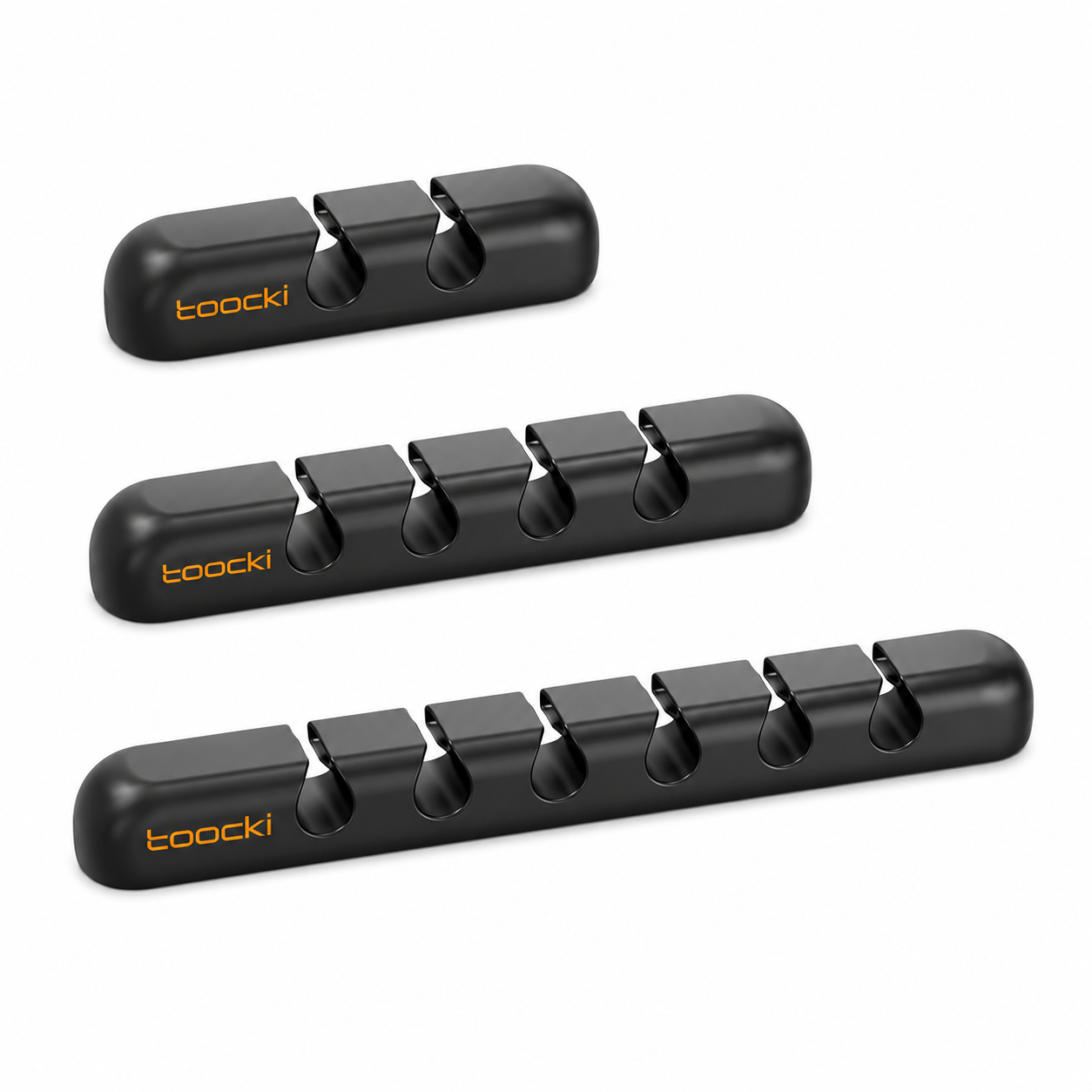 Three black Toocki sharpening stones arranged diagonally on a clean white background, with the brand name 'toocki' printed in orange on the side of each stone.