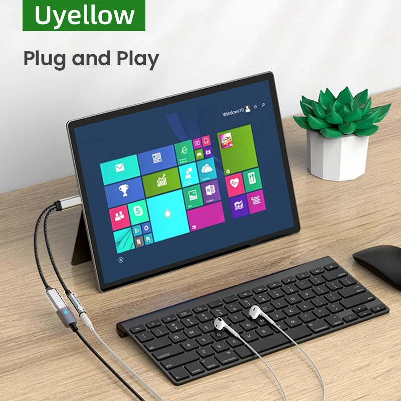 Tablet with keyboard and mouse on a desk, featuring Uyellow branding.