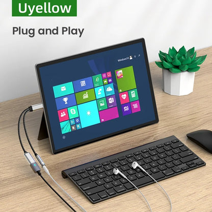 Tablet with keyboard and mouse on a desk, featuring Uyellow branding.