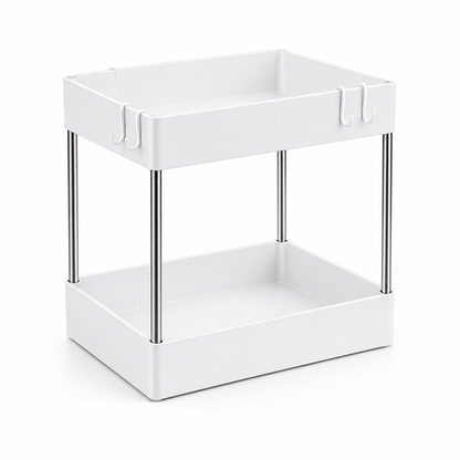 A white two-tier kitchen organizer cart with slim silver metal legs and small hanging hooks on the top tray, shown on a clean white background.